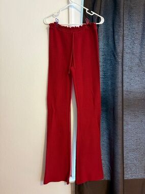 I am Gia red knit pants